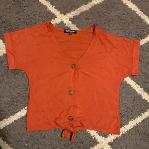 Short sleeve button up shirt with tie at bottom